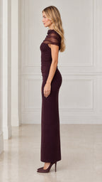 Side profile view of burgundy ruched maxi gown showing sleek column fit