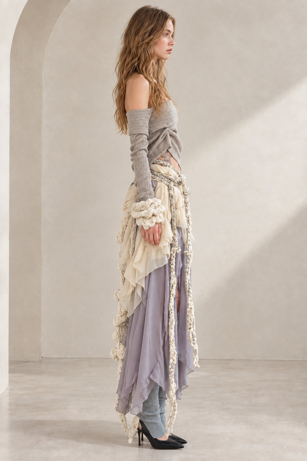 Side profile of model wearing Lavender Grey layered boho two-piece maxi skirt set