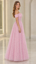 Side profile view of woman modeling pink sparkling floor-length formal ball gown