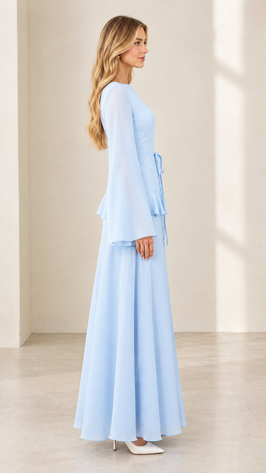 Side profile view of light blue bell sleeve tiered waist maxi dress
