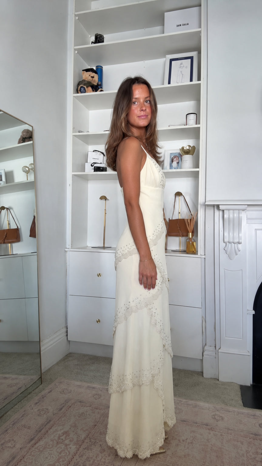 Side profile view of the Ivory Beaded Scalloped Tiered Maxi Slip Dress