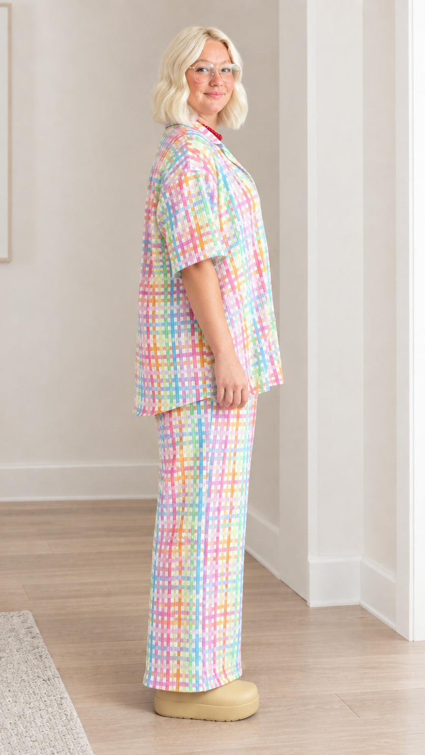 Side profile of model wearing colorful pastel plaid matching two-piece set