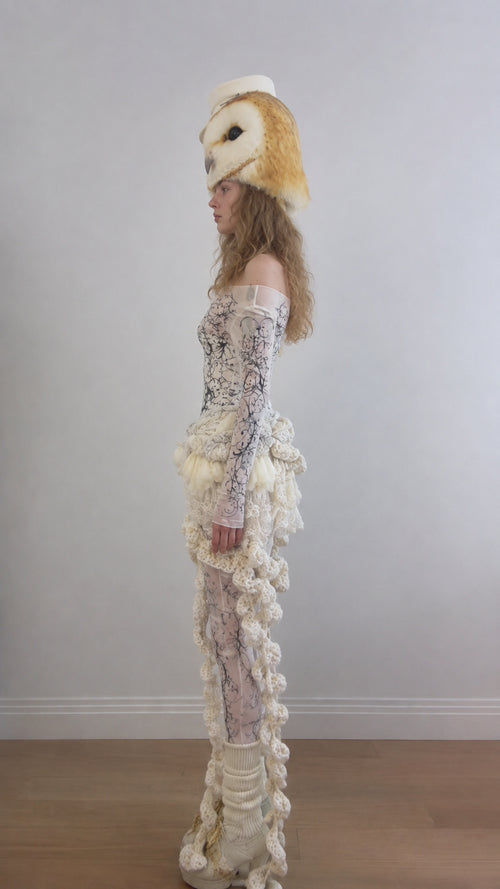 Side profile view of the Cream baroque printed bodysuit and textured ruffle attachment
