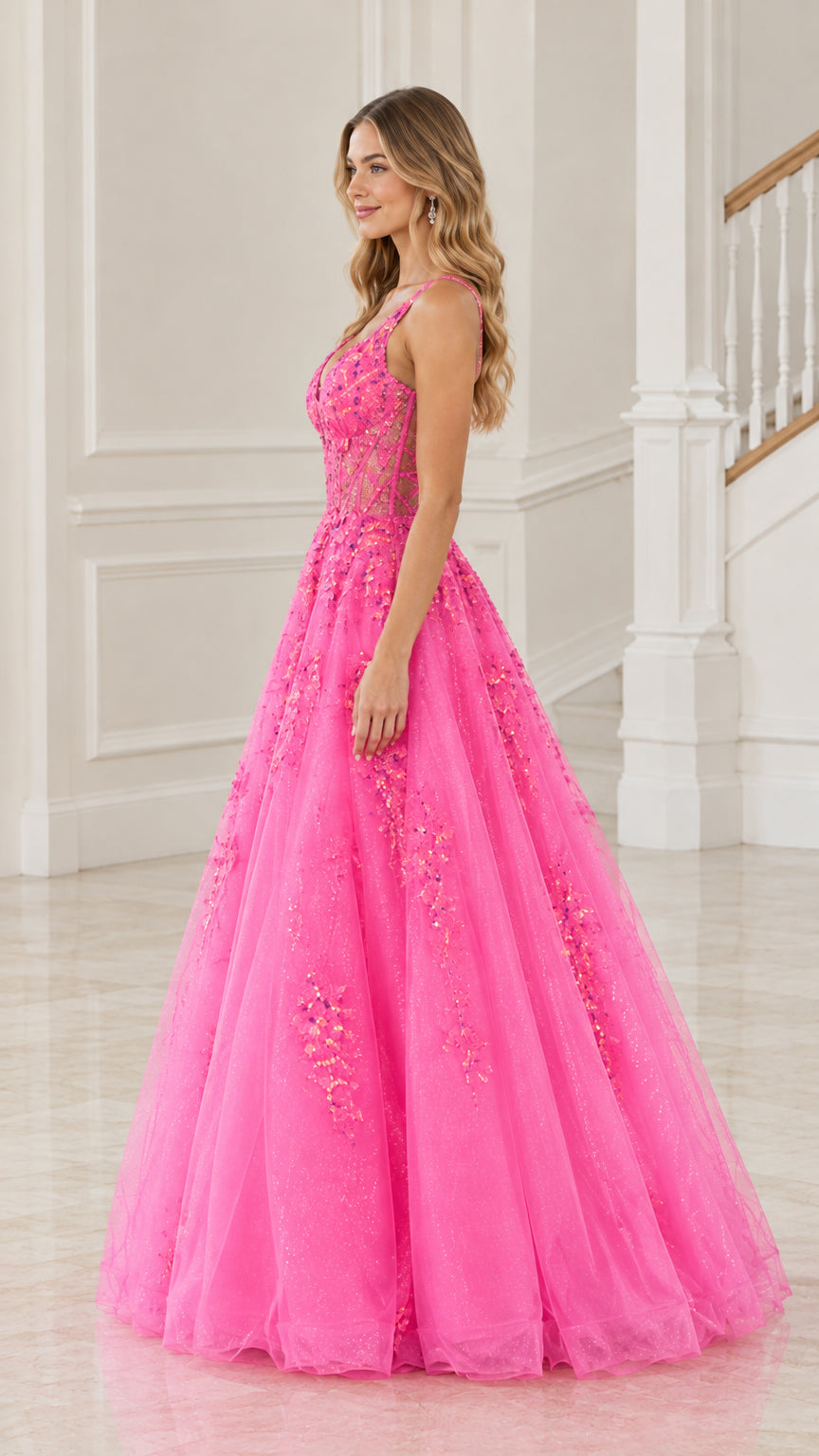 Side profile view of hot pink A-line tulle ball gown