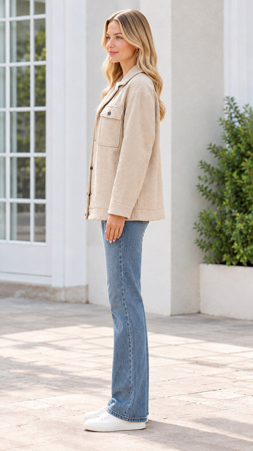 Side profile view of model wearing beige textured shirt jacket