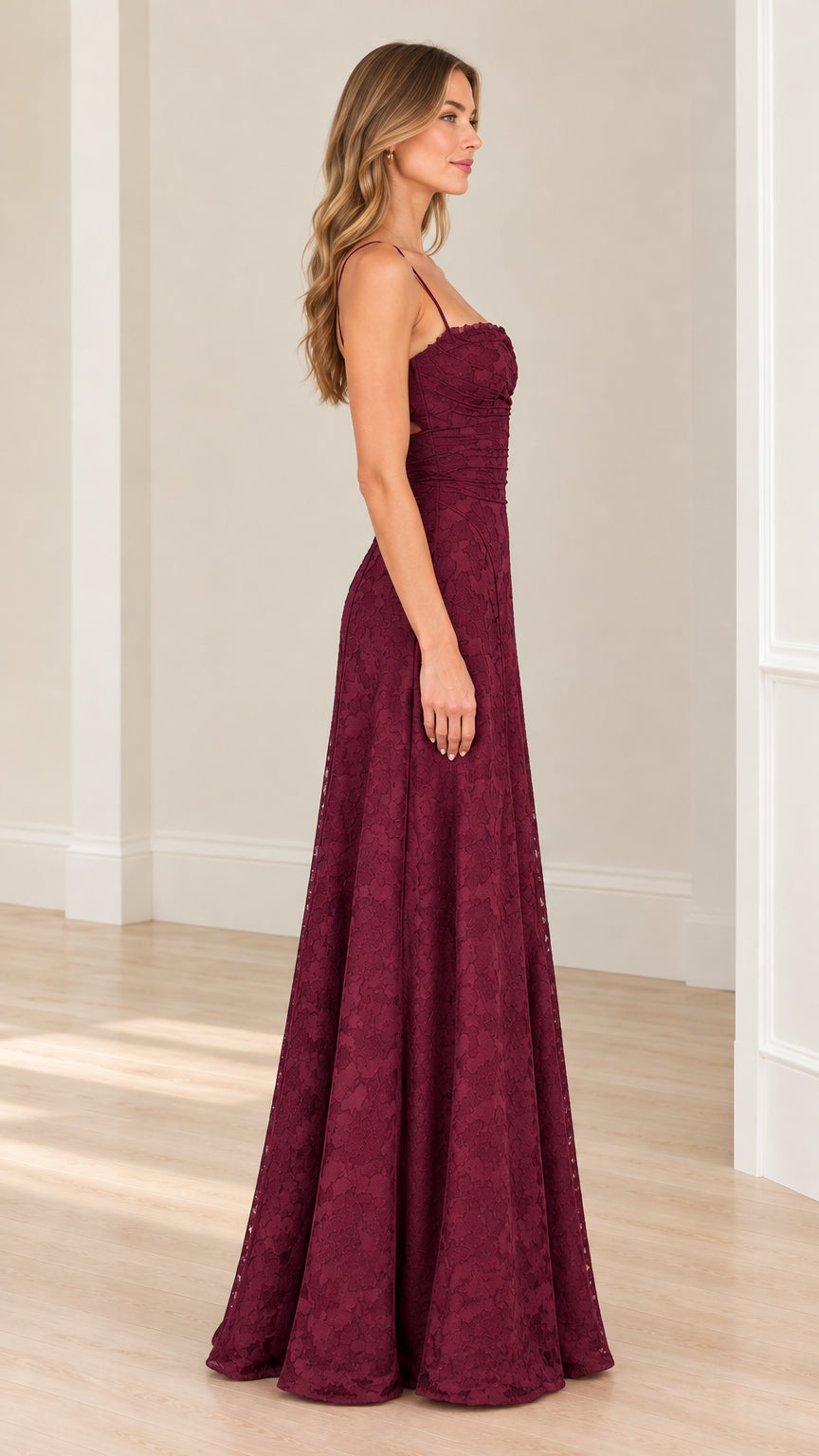Side profile view of burgundy lace maxi dress showing A-line silhouette and slender shoulder straps