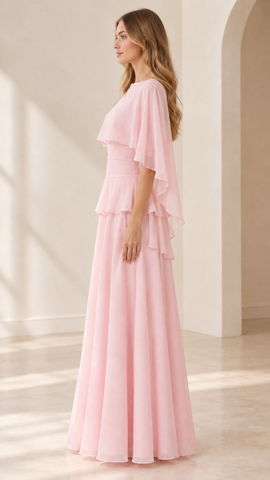 Side profile of pink floor-length capelet evening dress with tiered waist