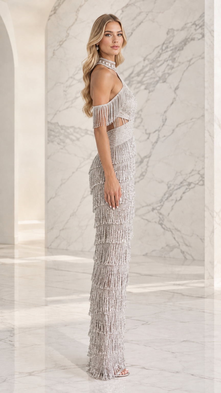 Side profile of silver beaded fringe evening dress showing tiered tassels and column silhouette