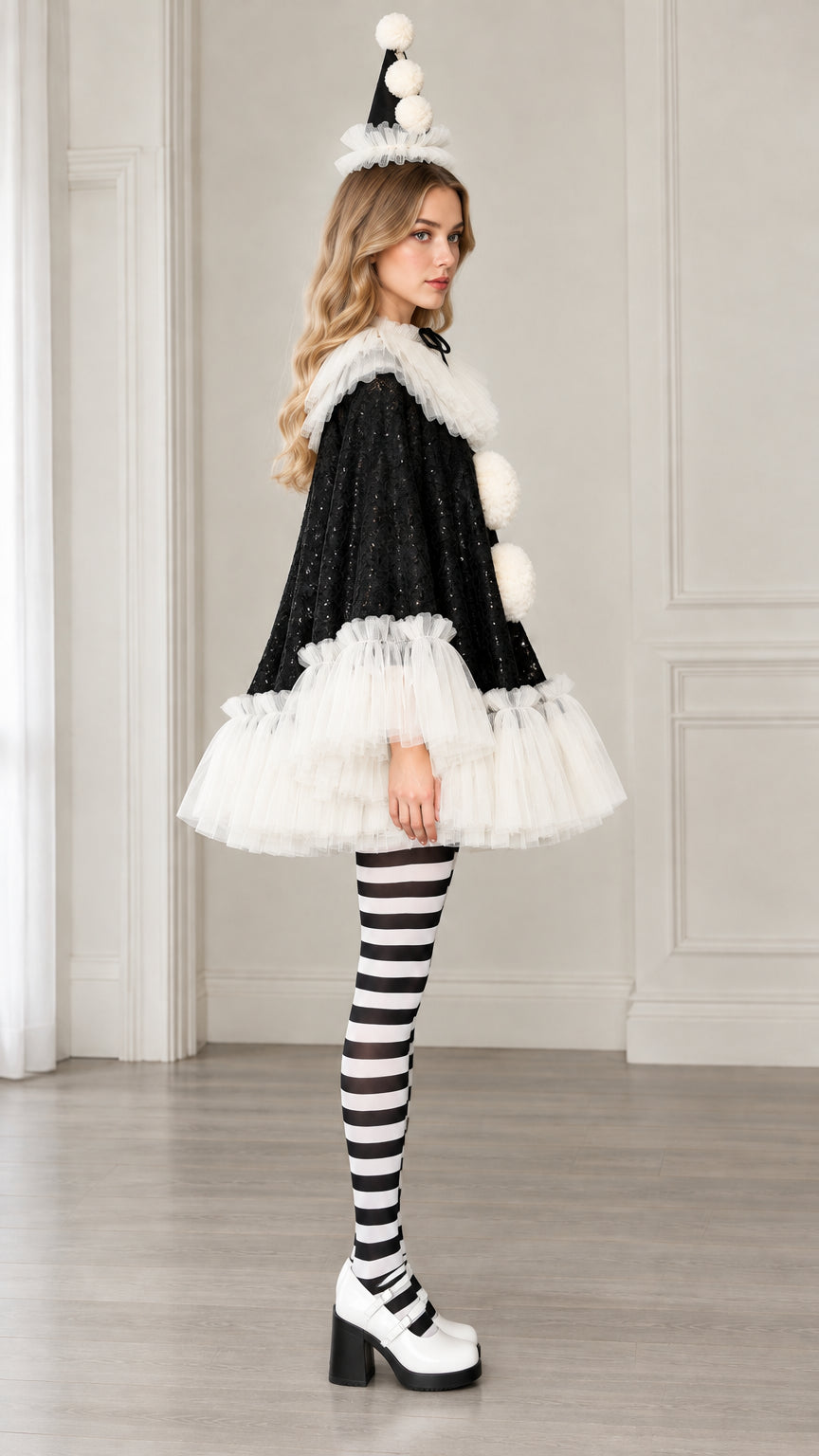 Side profile view of black sequin Pierrot cape costume showcasing the flared A-line silhouette and white ruffled trims