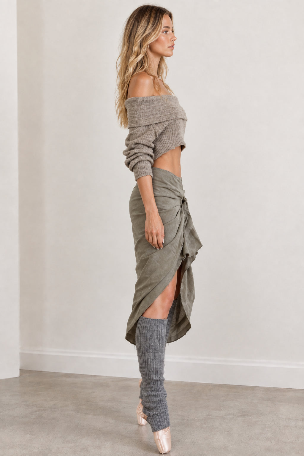 Side profile view of woman wearing sage green knit matching set