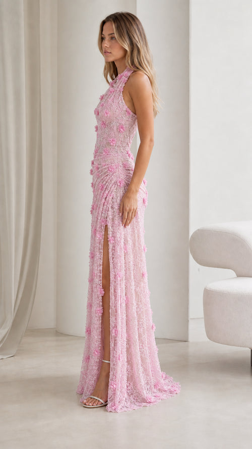 Side profile view of blush pink floral lace gown showing gathered waist and slit