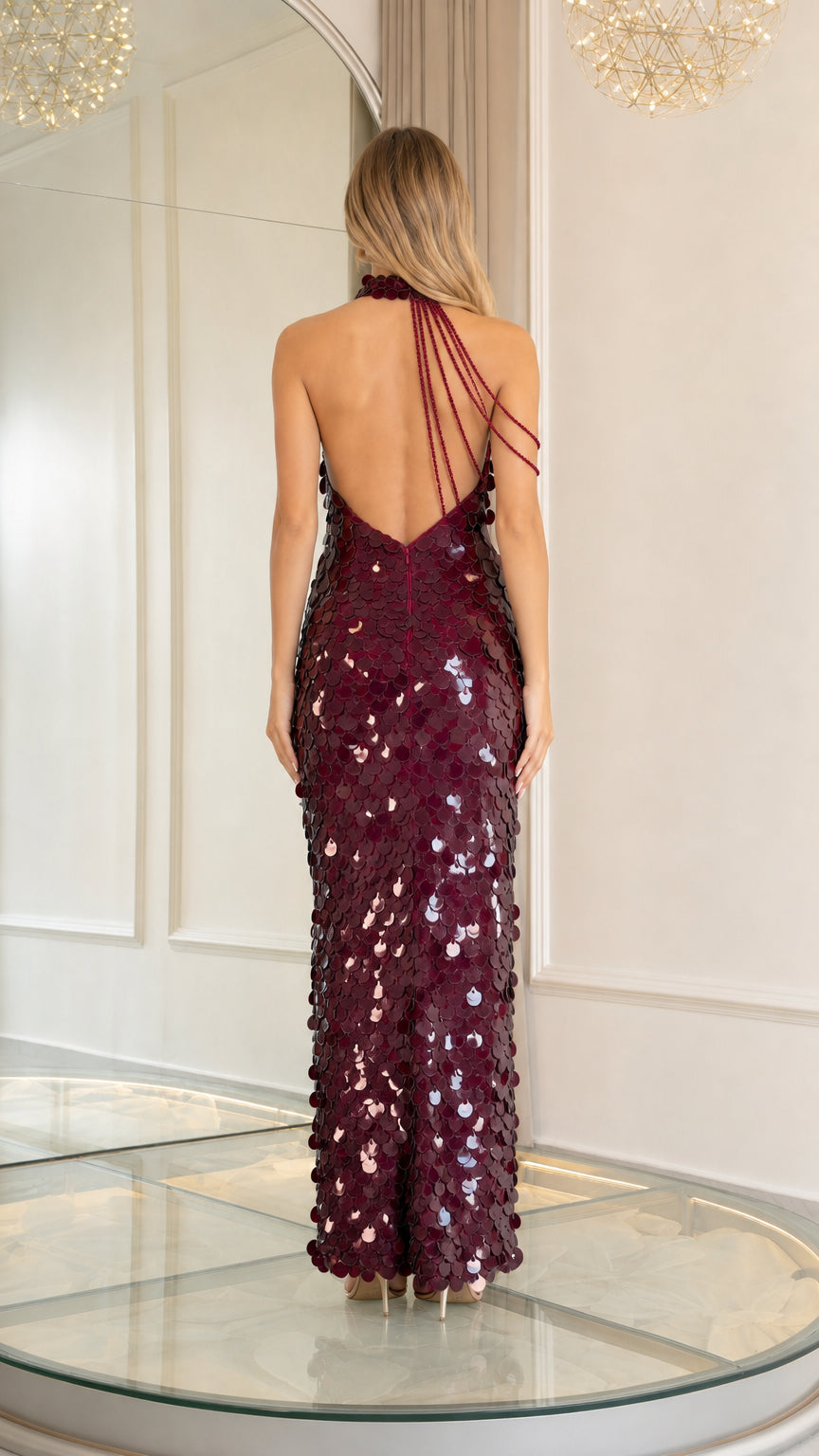 Back view of model showing open back design on burgundy sequin maxi dress
