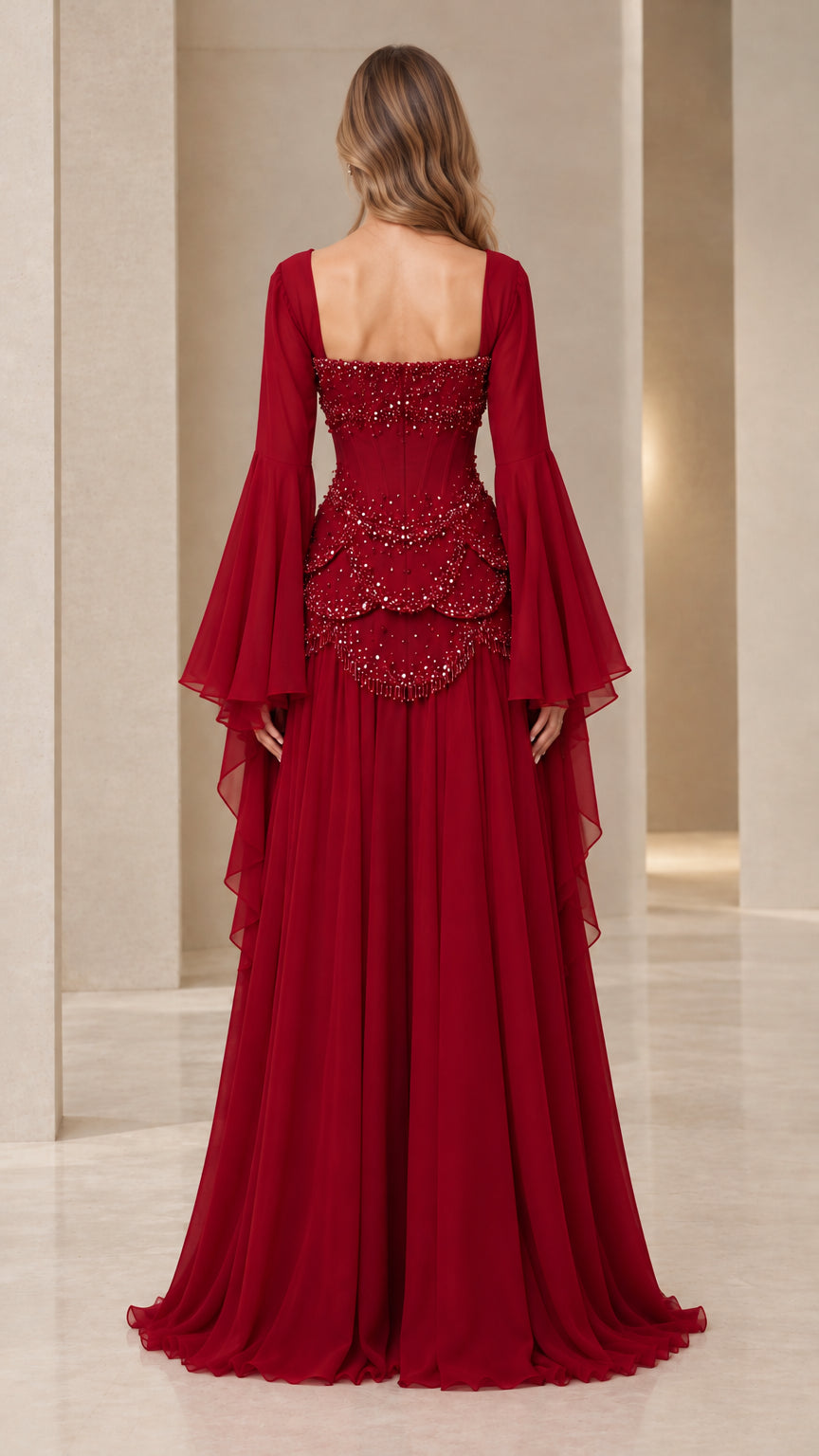 Back view of burgundy formal gown featuring square back neckline and sweeping skirt