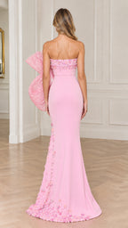 Back full view of pink strapless evening gown showing oversized bow and train