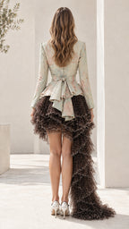 Rear view showing bow tie back peplum jacket and cascading tiered ruffled skirt