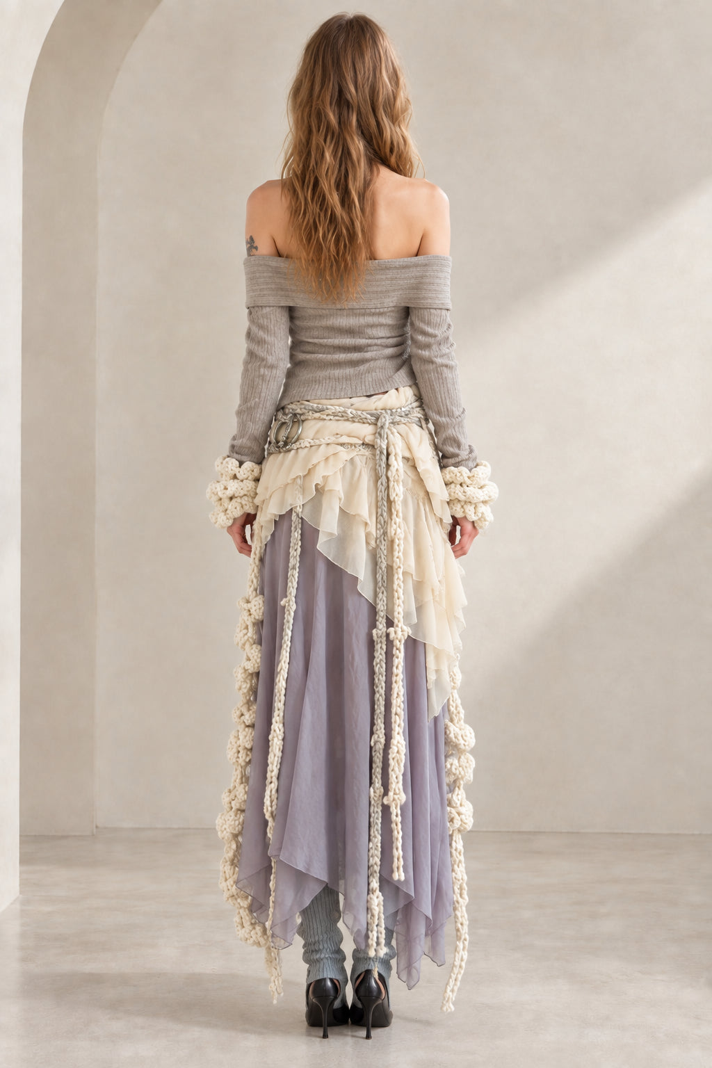 Back view of model in Lavender Grey off-the-shoulder wrap top and asymmetrical maxi skirt