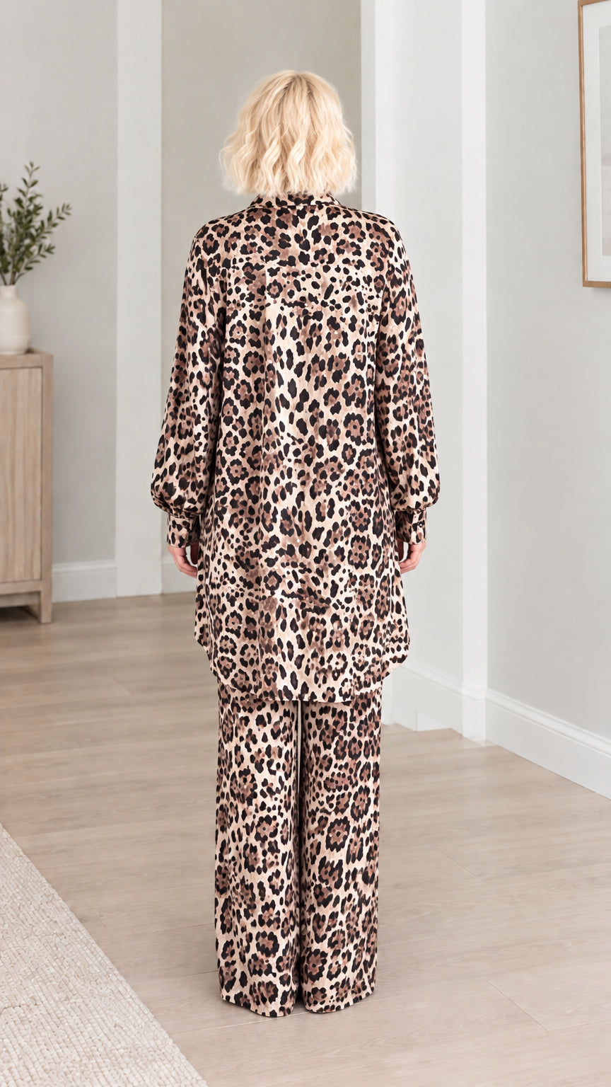 Back view of model showing the flowing fit of the leopard print longline tunic and pants