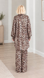 Back view of model showing the flowing fit of the leopard print longline tunic and pants
