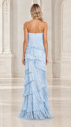 Back view of model showcasing light blue strapless tiered fringe maxi gown