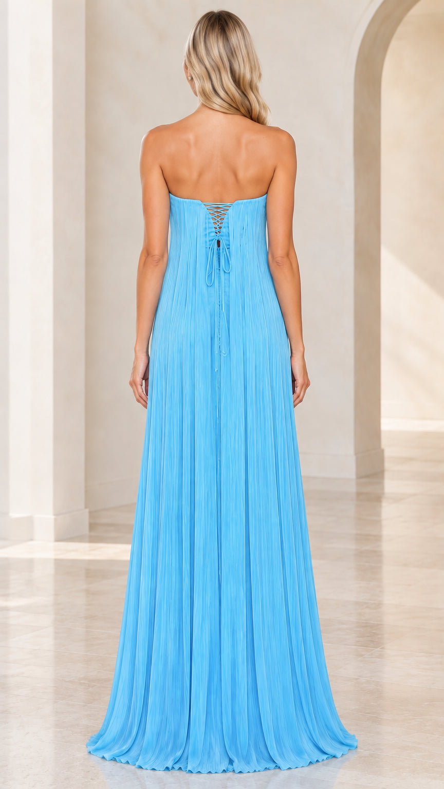 Rear view showing lace-up corset back detail on sky blue strapless pleated dress
