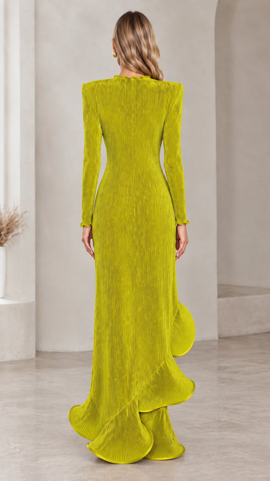 Back view of chartreuse pleated maxi dress highlighting the continuous vertical pleats and flowing hem