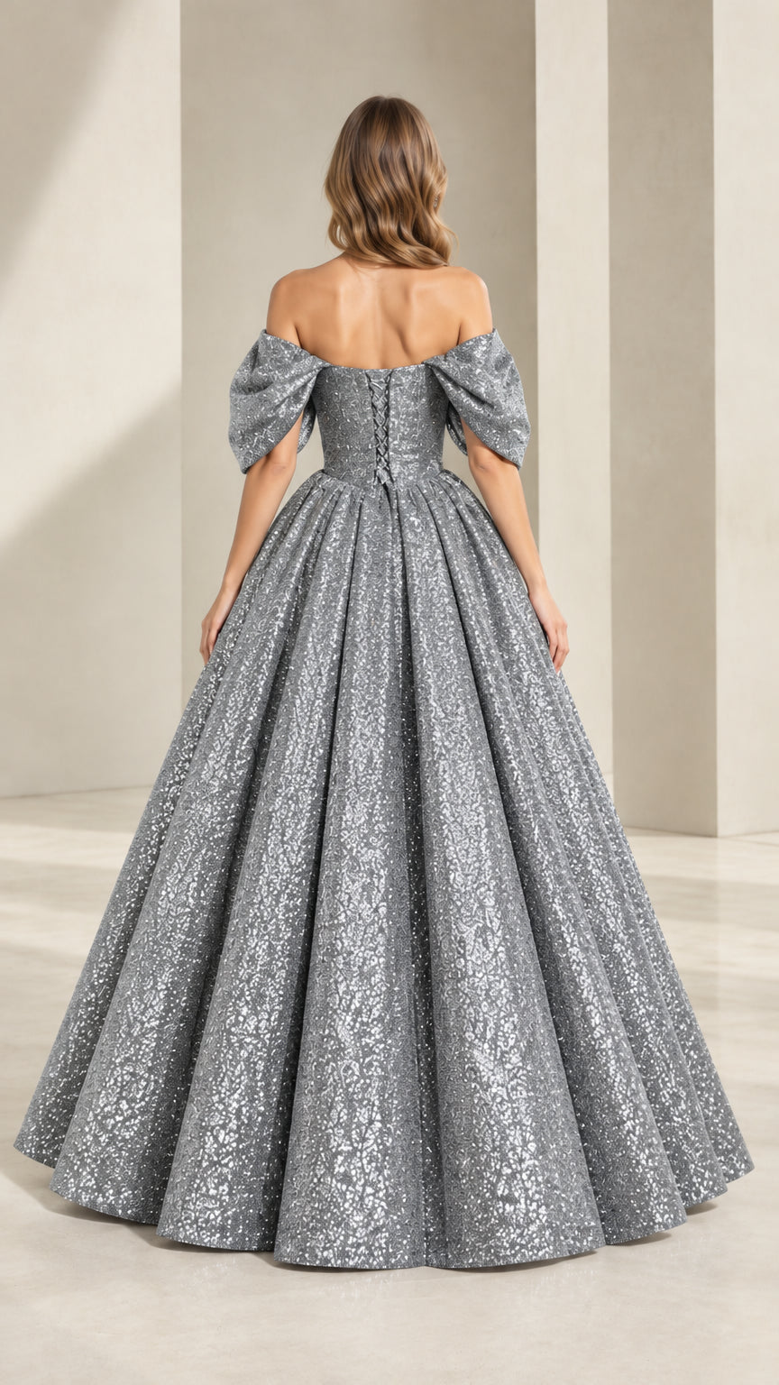 Back view of model showing lace-up corset back of silver gray sequin ball gown