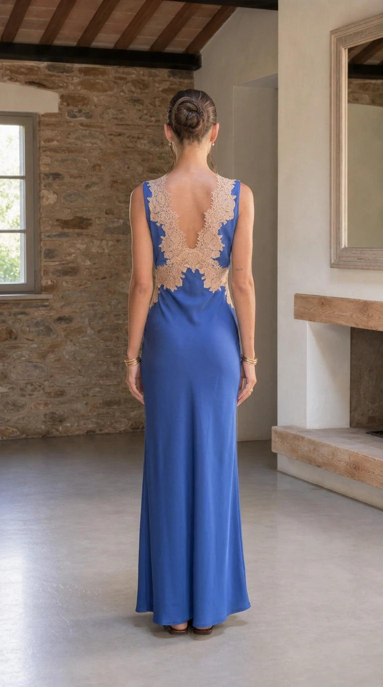 Back view of royal blue satin gown showing low lace-trimmed back detail