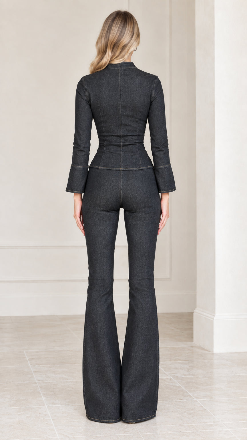 Back view of model showing tailored fit and flared pant leg silhouette