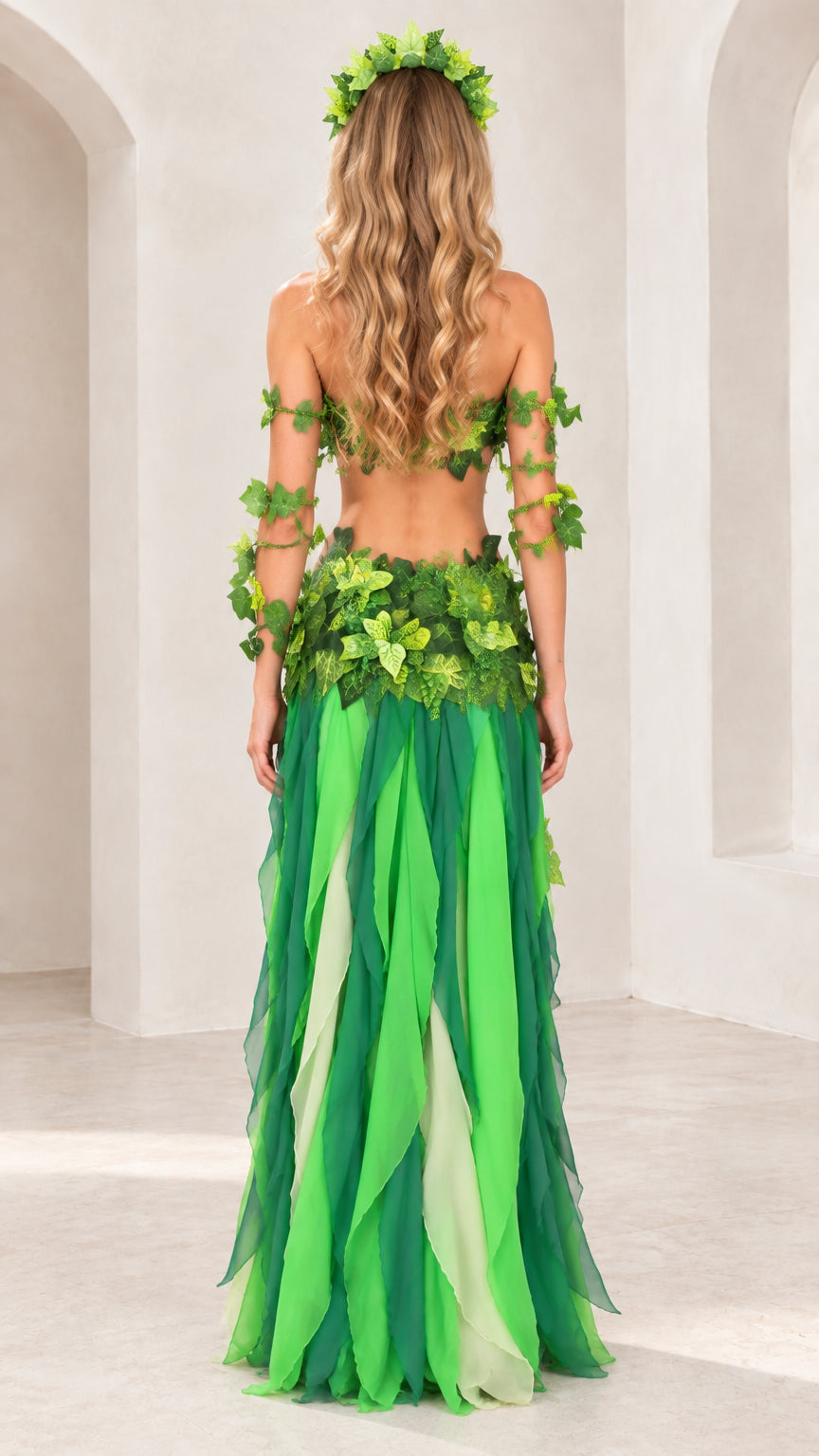 Back view of the green ivy costume highlighting the open back top and maxi chiffon skirt