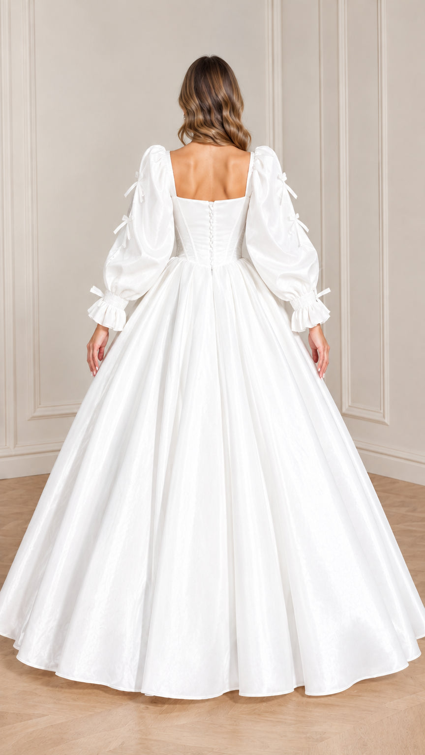 Back view of white evening ball gown showing square back and button closure detail