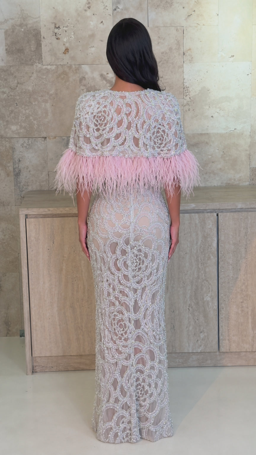 Silver and pink feather-trimmed formal evening gown back view