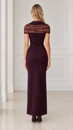 Back view of model wearing burgundy cowl neck evening gown with back zipper detail