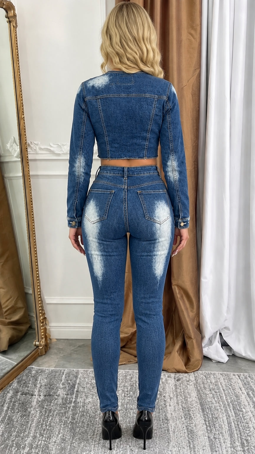 Model wearing blue acid wash cropped denim jacket and skinny pants set - back view