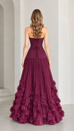 Rear view of model wearing burgundy evening gown showing lace-up corset back closure
