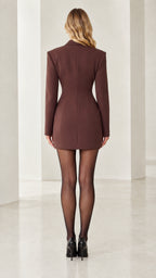 Back view of woman wearing brown fitted blazer mini dress showcasing waist contouring
