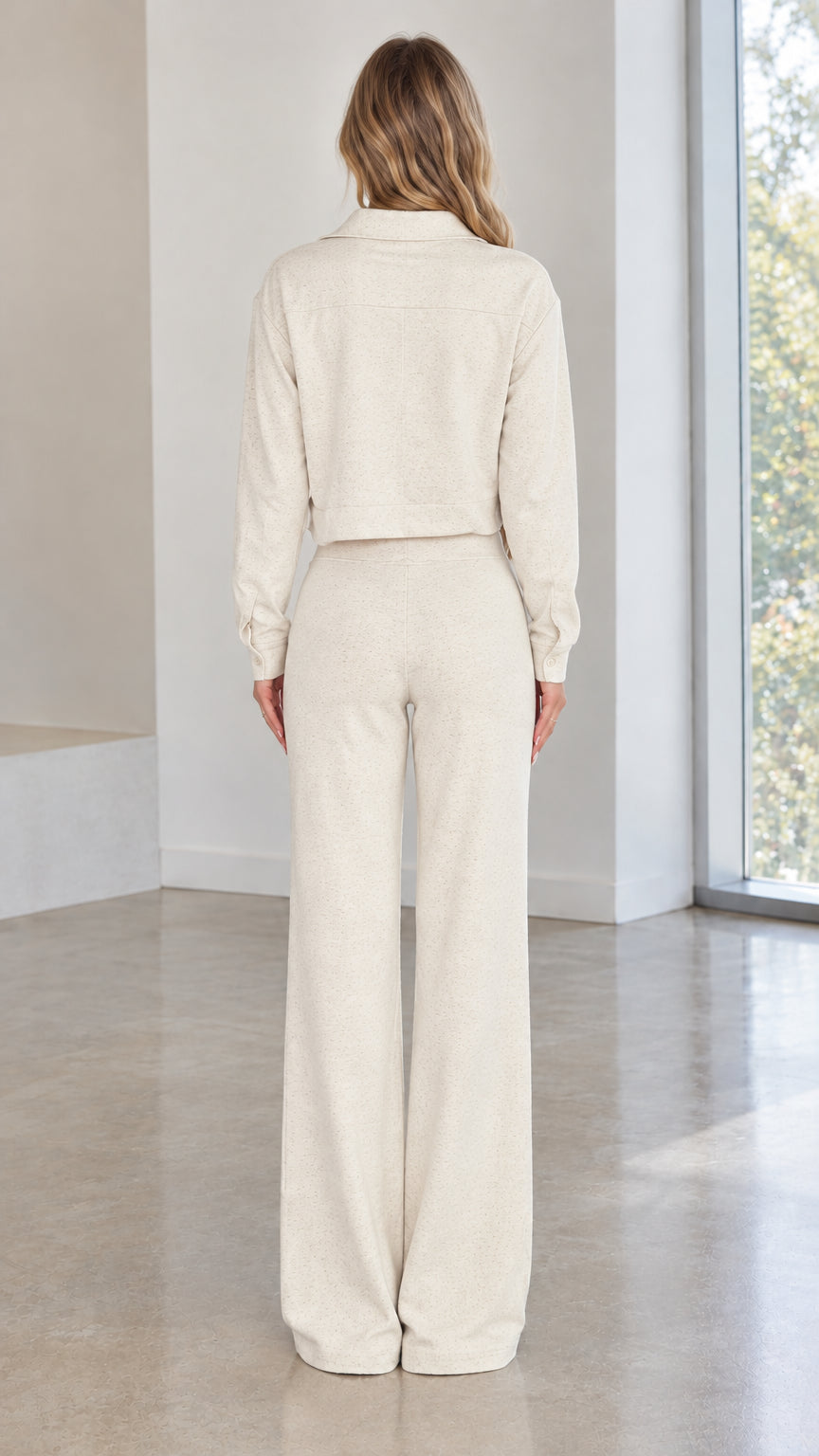 Back full view of woman wearing cream textured knit two-piece lounge set
