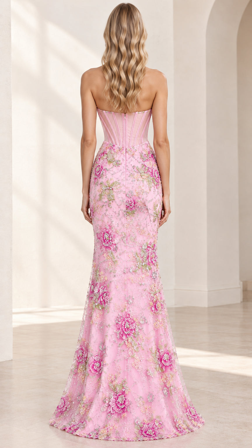 Back view of woman wearing pink strapless boned corset gown with floral embroidery