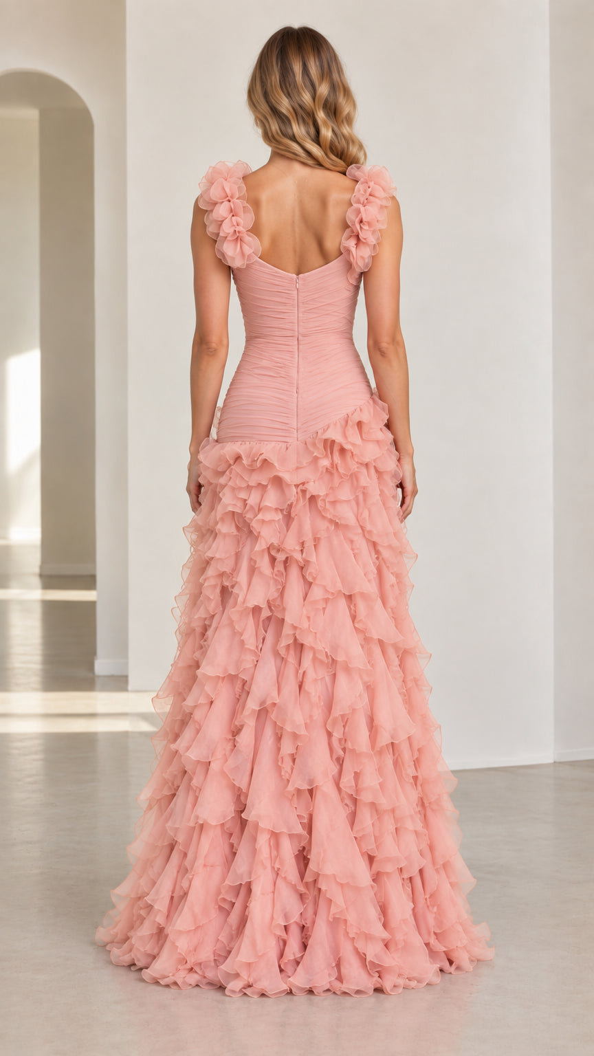 Back view of model wearing dusty pink ruched back ruffle maxi evening dress