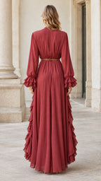 Back full-length view of rust red long sleeve pleated maxi dress with ruffled cuffs