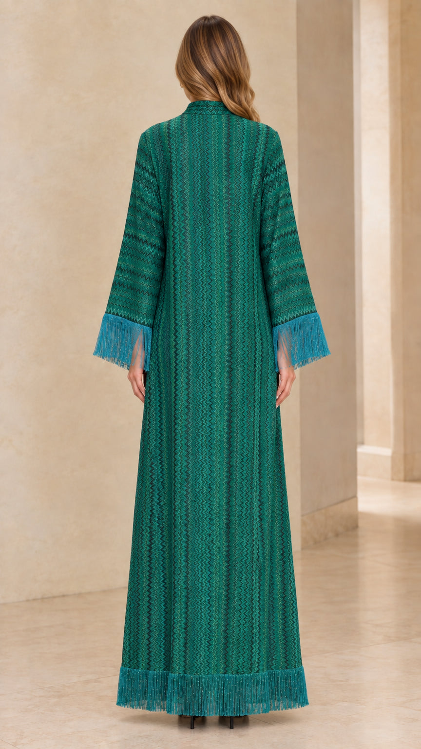 Back full view of emerald green long sleeve maxi dress highlighting column silhouette and textured knit