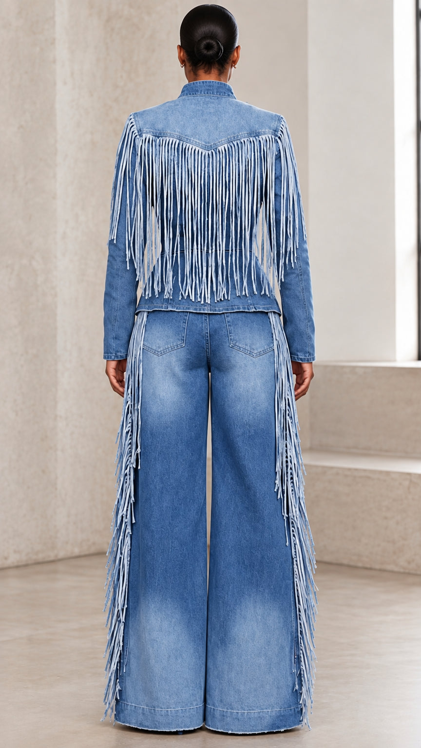 Back view of model wearing blue denim fringe jacket and wide leg trousers