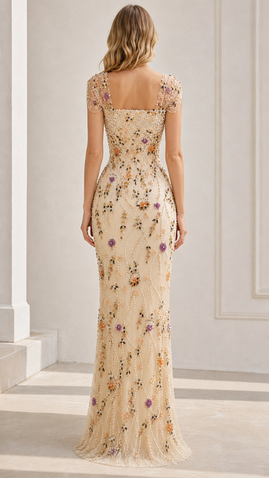 Back view of champagne beaded floral column gown showing square back neckline