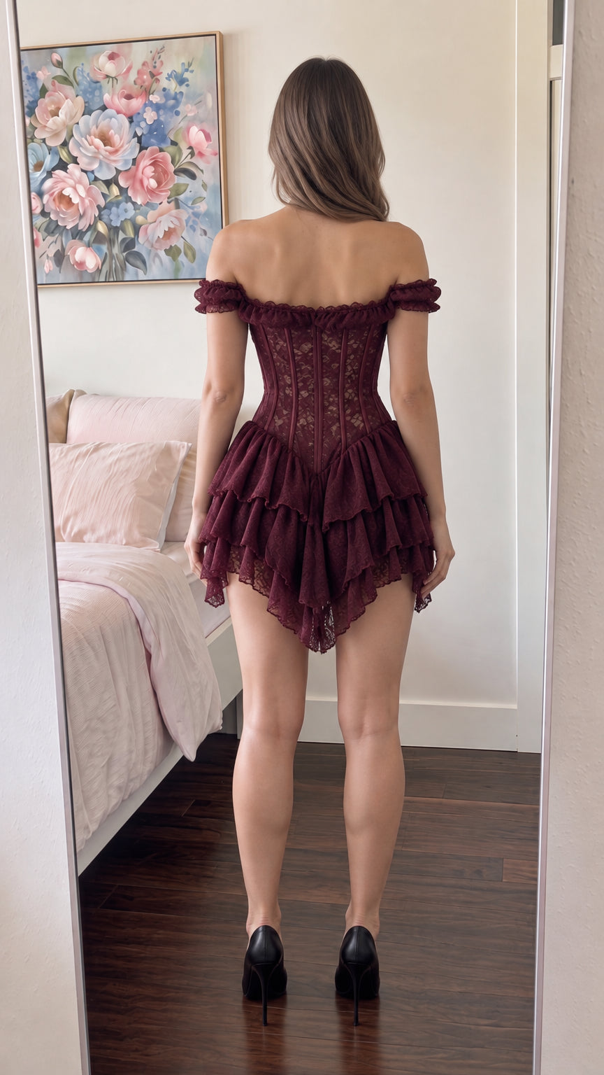 Back view of woman wearing burgundy corset ruffle dress showing structured back fit