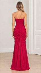 Back full-length view of model wearing magenta strapless ruched maxi dress