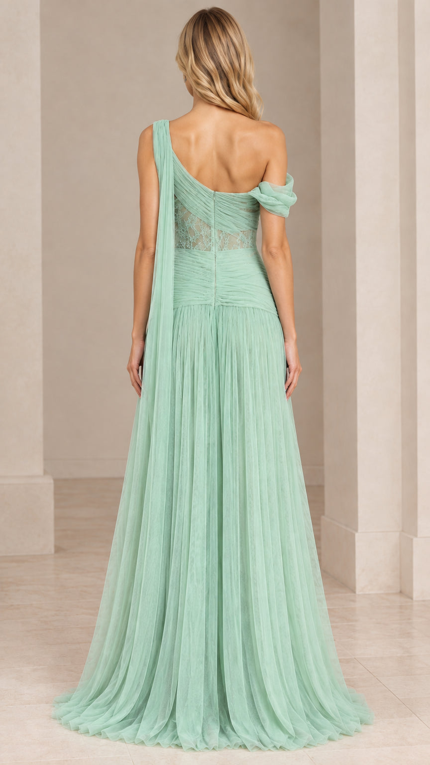 Back view of sage green flowing tulle evening dress showing shoulder drape