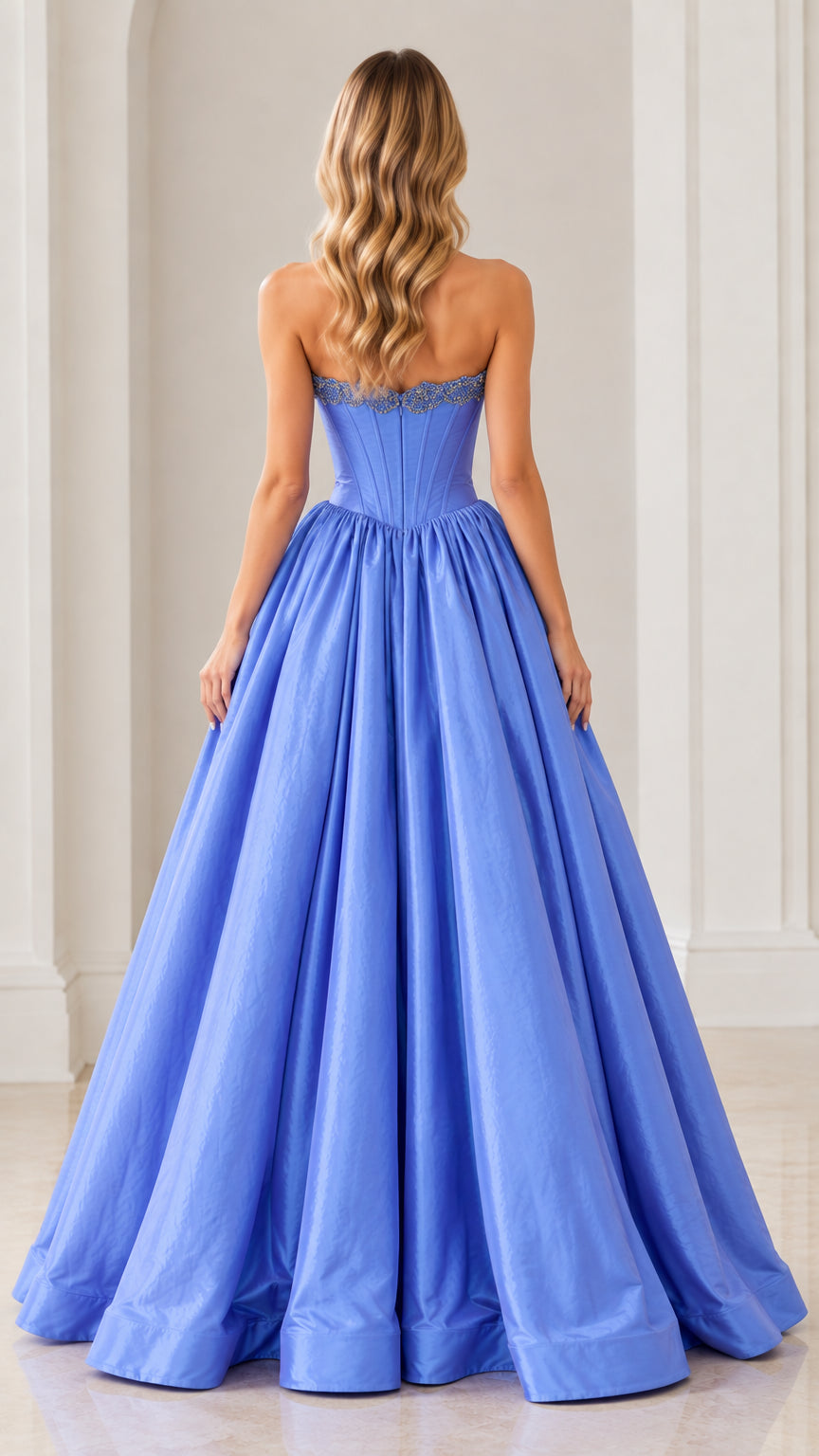 Back view of model wearing periwinkle blue strapless evening gown with full gathered skirt
