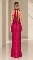 Back view of magenta formal gown showing low open back with suspended drape ties