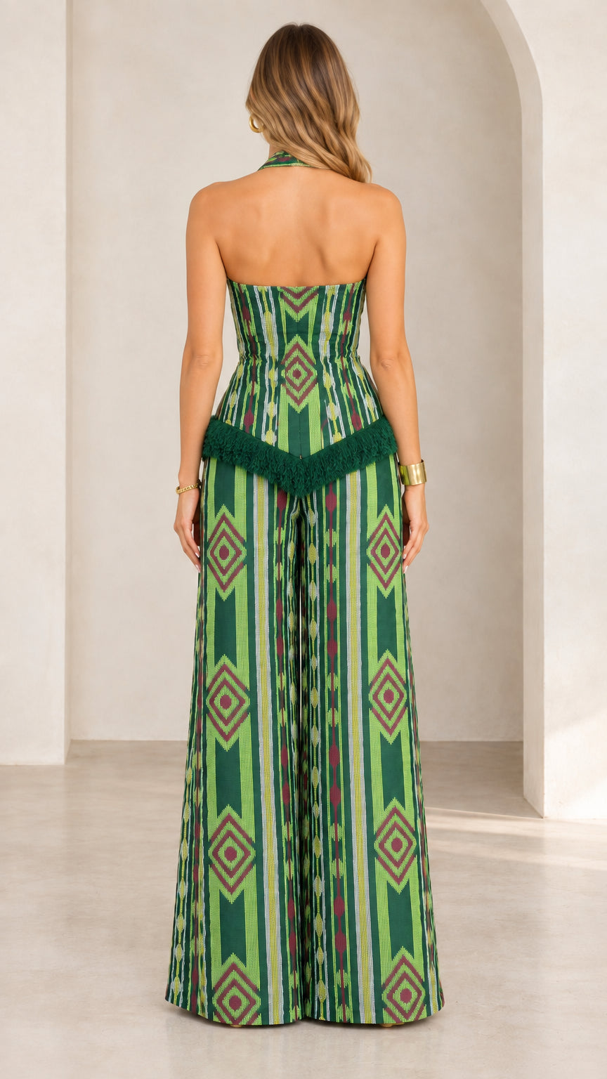 Back view of green geometric print halter top and matching wide leg pants