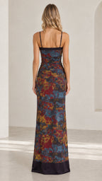 Back view of model showing straight neckline and floor length hem of Navy Multi maxi dress