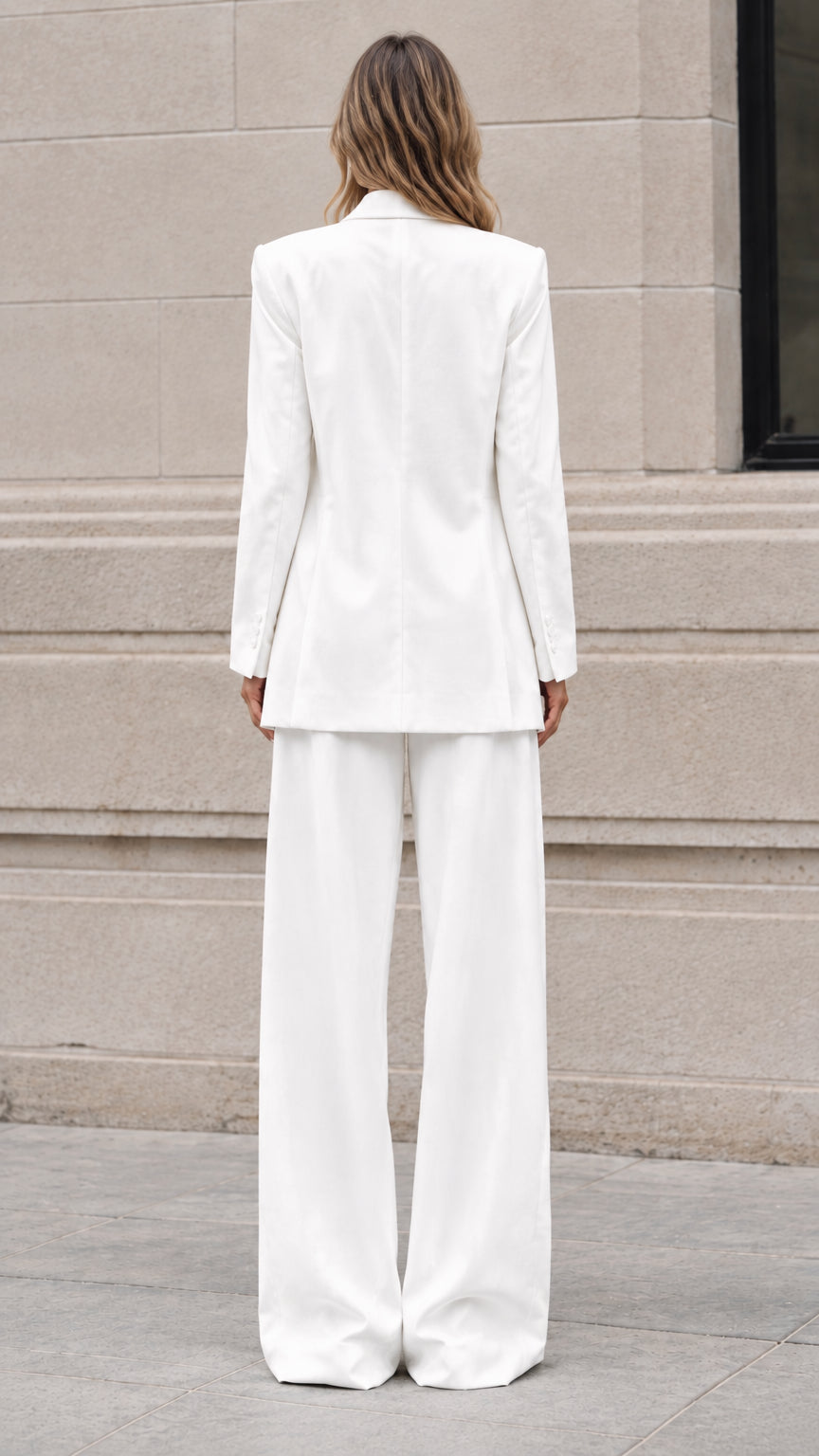 Back view of white longline tailored blazer and high-waisted wide-leg trousers